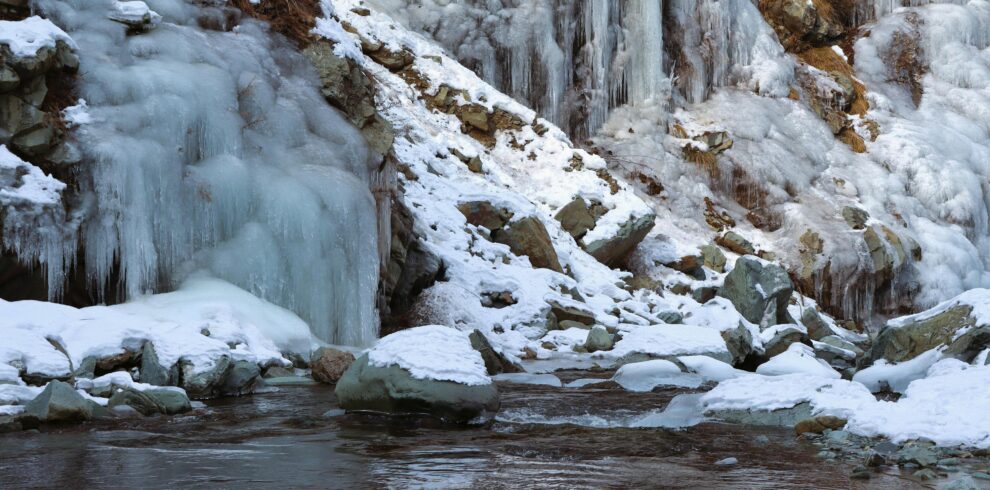 Snow on Rocks by the Stream